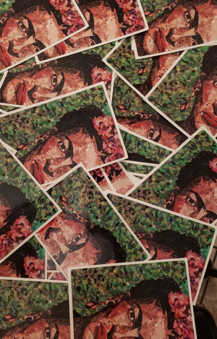 A pile of stickers with a picture of a man 's face.