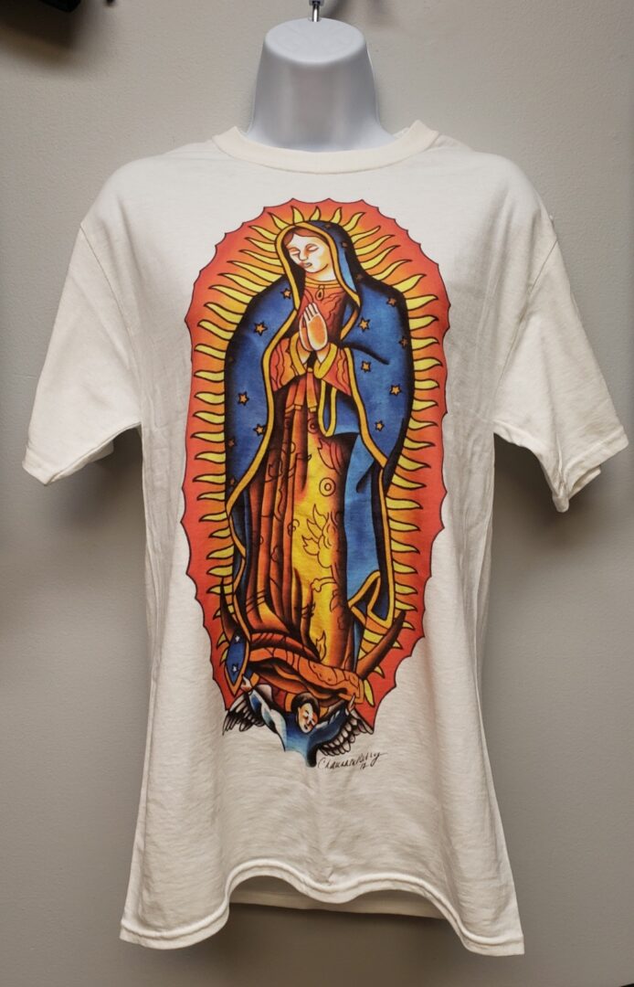 A white t-shirt with an image of the virgin mary.