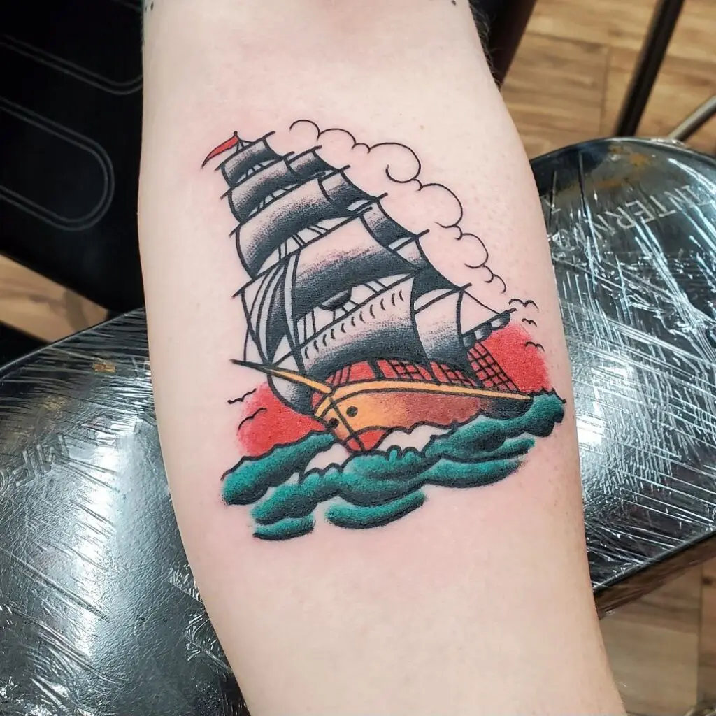A tattoo of a ship on the arm